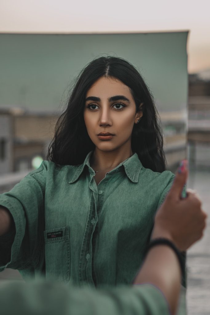 woman in green button up shirt